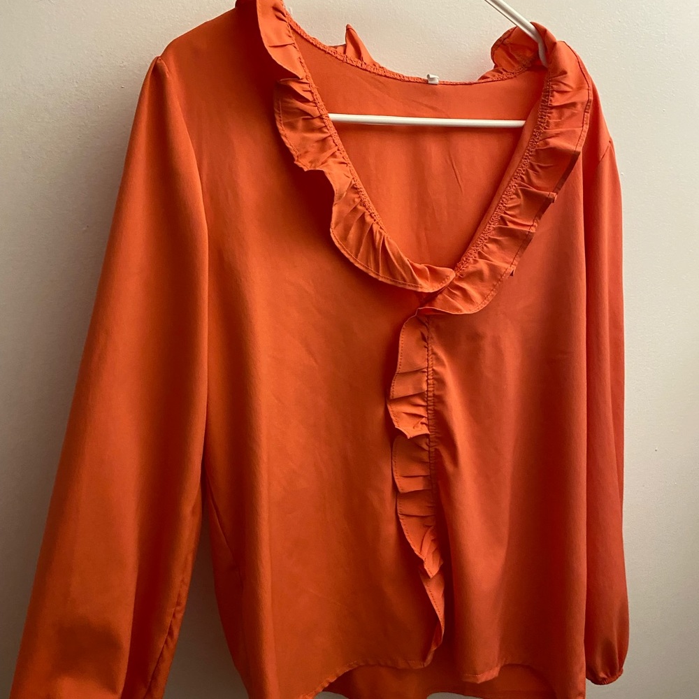 Coral ruffle v-neck blouse